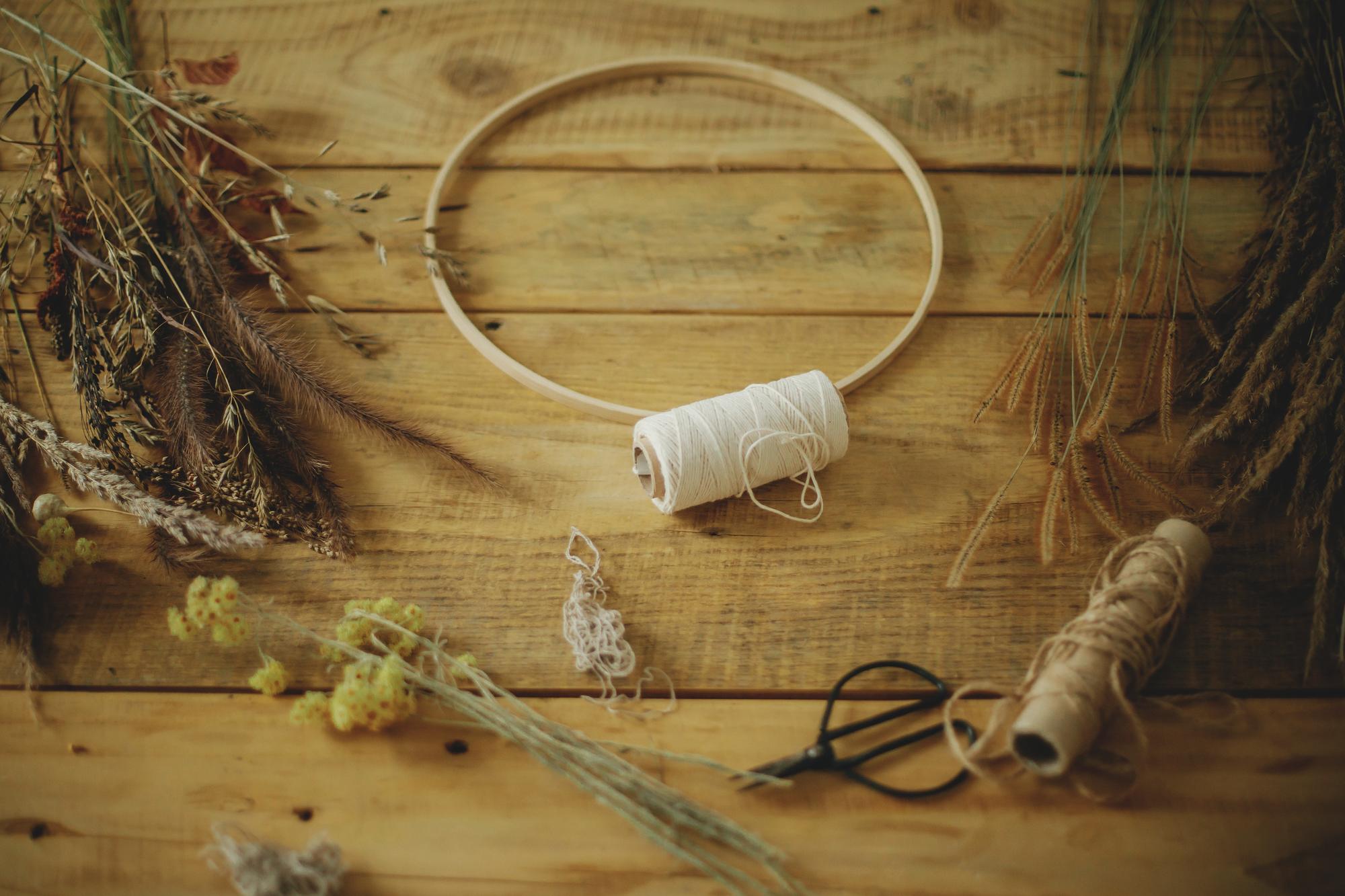 Studio table with embroidery hoops and tools
