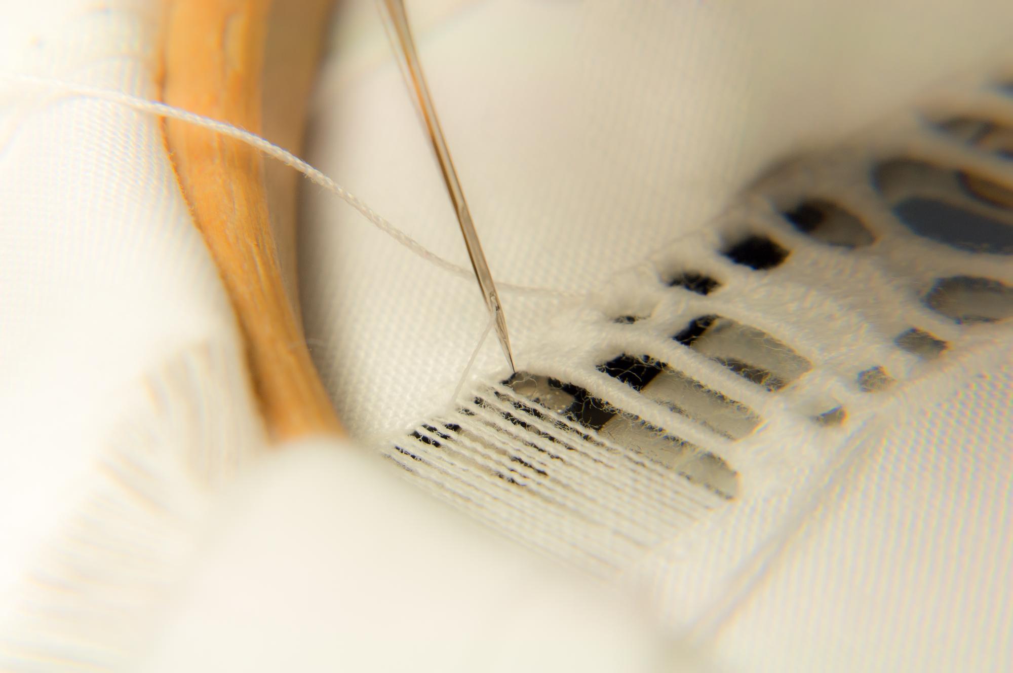 Close up of hand embroidery threads on linen